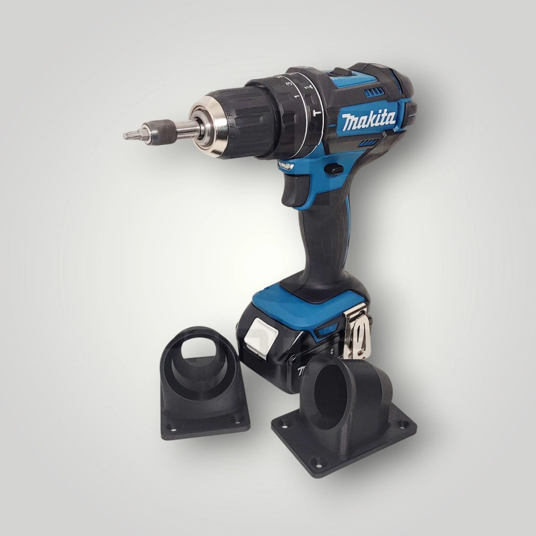A blue and black Makita cordless power drill stands upright with two black attachments on a light gray background—ideal for use with the Wandhalter für Makita Akkuschrauber 18V in your workshop.