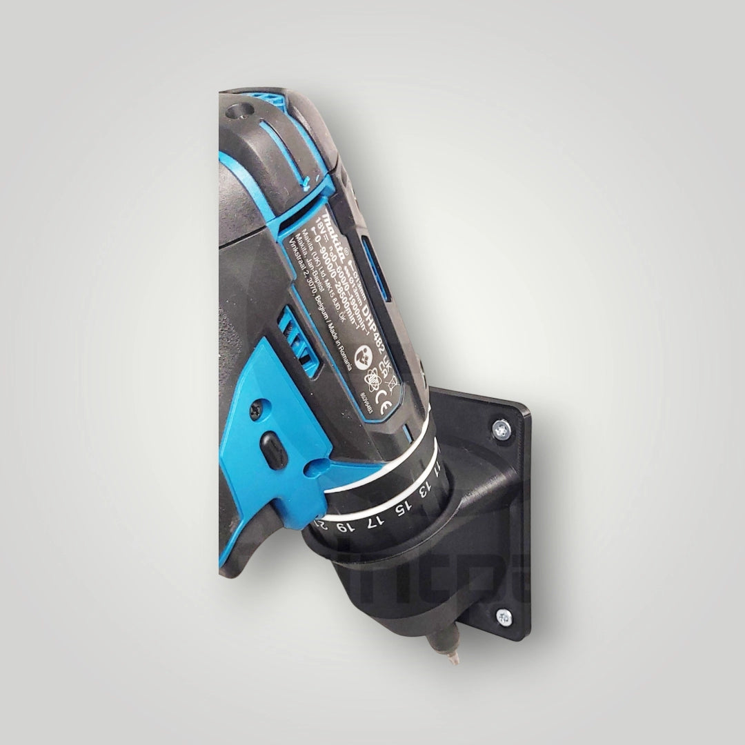 The Wandhalter für Makita Akkuschrauber 18V securely holds a blue and black cordless drill, mounted vertically on a black wall bracket against a light gray background—perfect for Werkstatt Aufbewahrung.